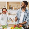 positive-dad-and-daughter-having-fun-on-kitchen
